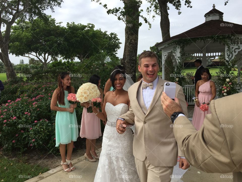 Wedding . Bride and groom video chatting after wedding ceremony 