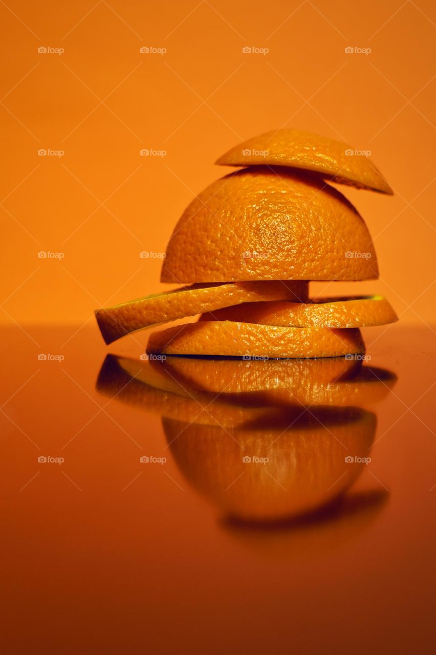 Sliced orange reflected in the glass surface