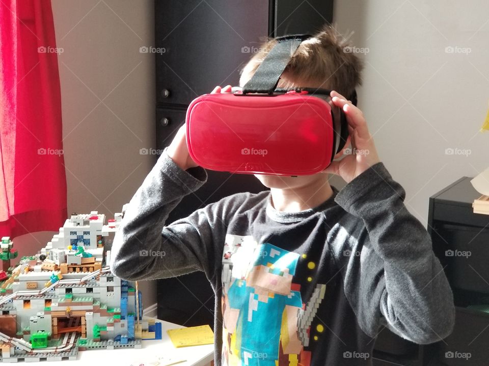 Young boy using a virtual reality headset