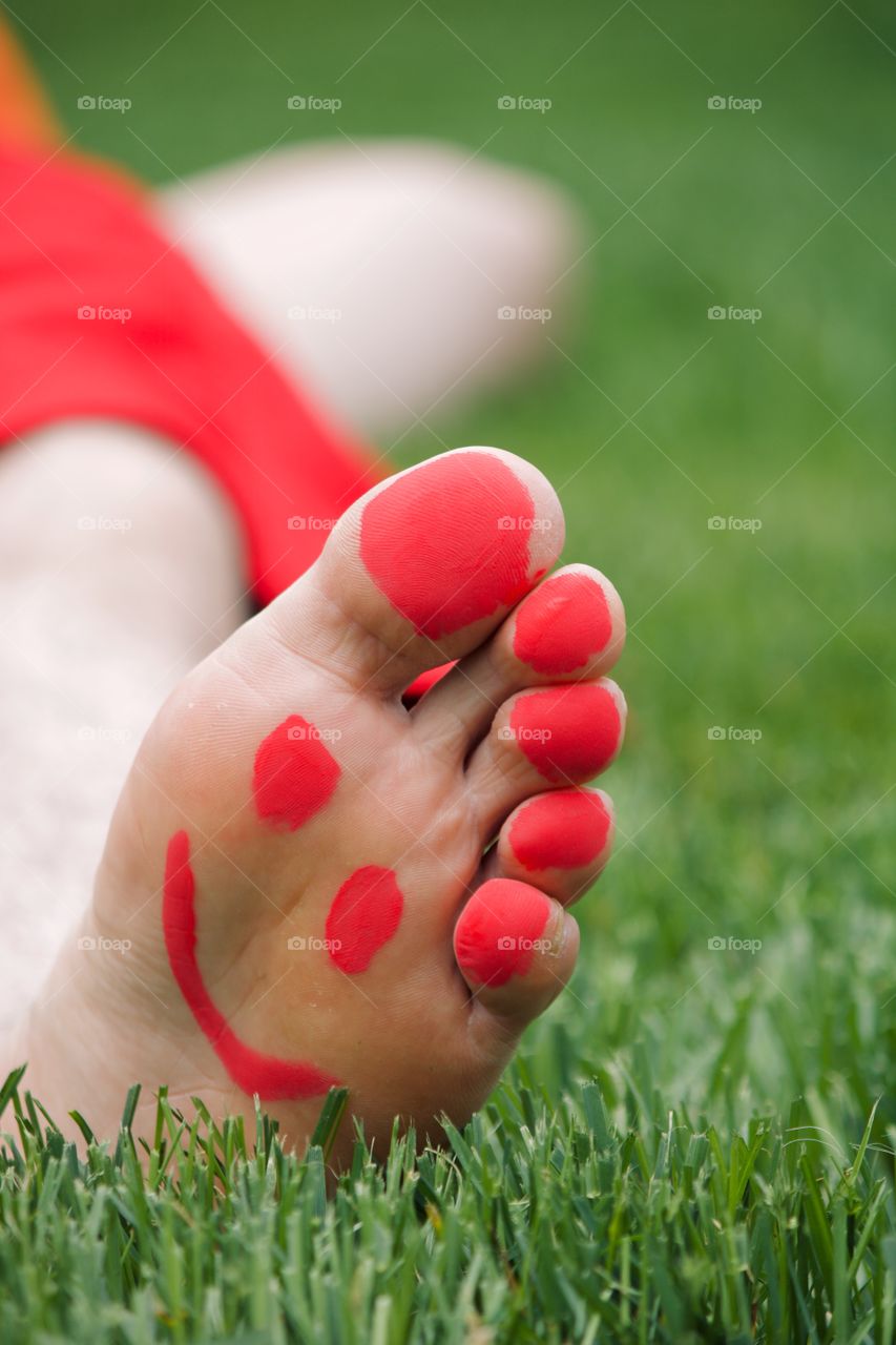 Happy feet while laying on the grass