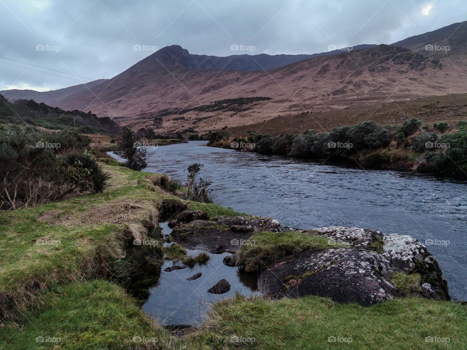 Beautiful landscape scenery at river Erriff with mountains in the background