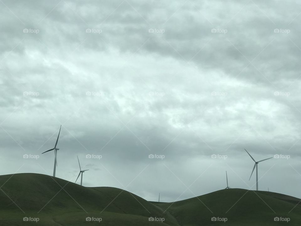 Green hills and stormy sky