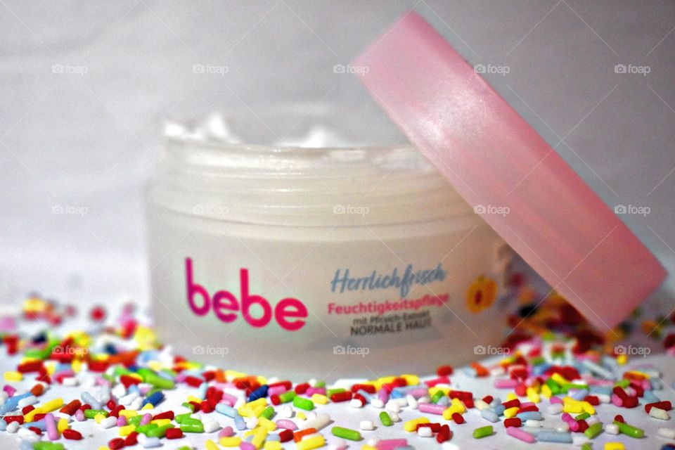 Soft peach cream surrounded by sugar sprinkles.