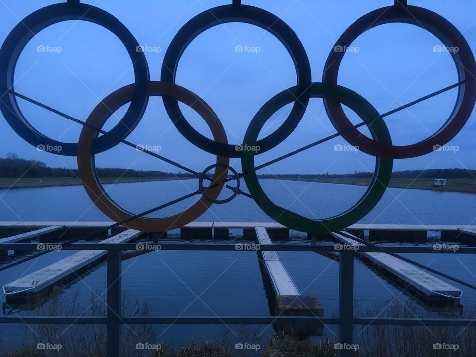View through the five Olympic Rings out along Eton Dorney lake, a London 2012 Olympic venue, on a Spring evening.