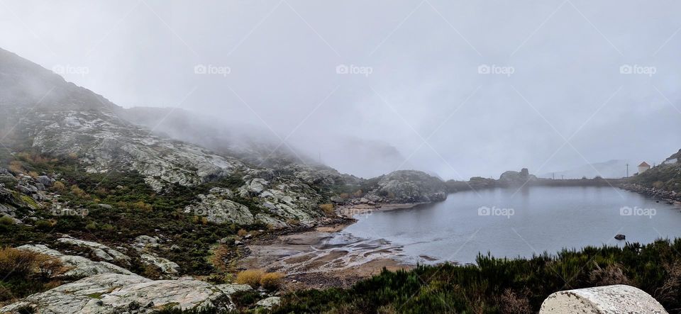 Top of the mountains in Serra da Estrela, Portugal. Small lake in between the rocks.