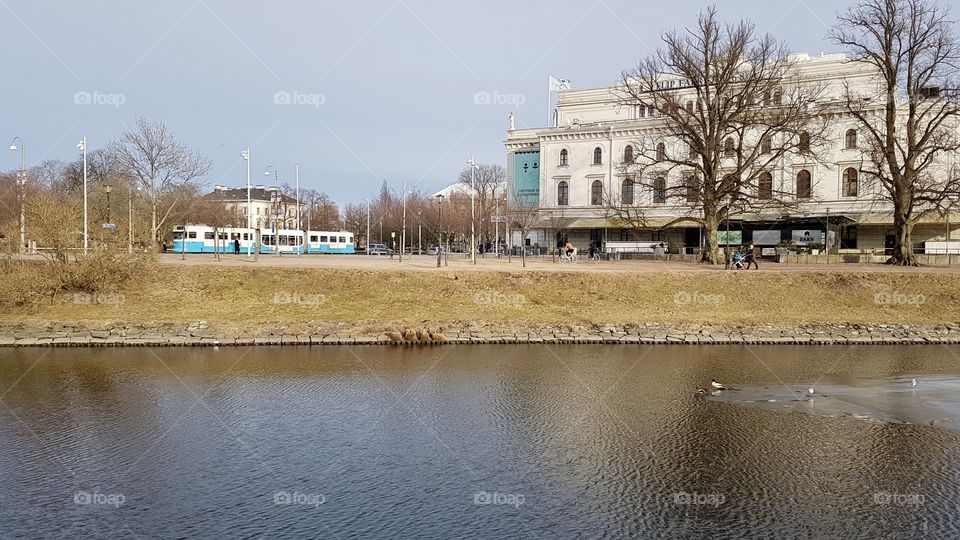 Tram and the canal in the city of Gothenburg Sweden  - spårvagn vid vallgraven kanal i Göteborg Sverige 