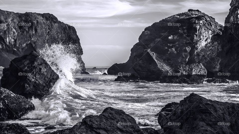 Wave crashing on rock