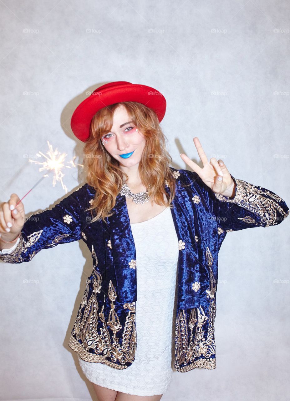 Woman With a make-up holding sparkler