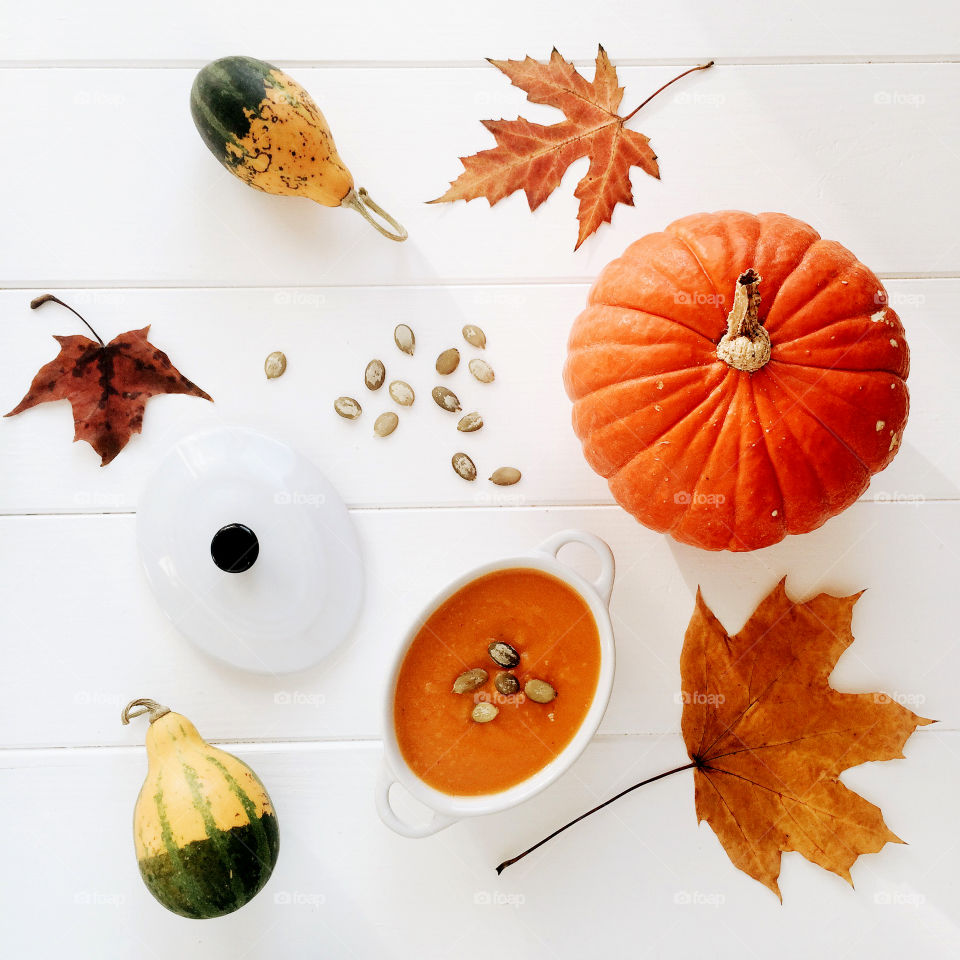 Pumpkin and seeds on white background