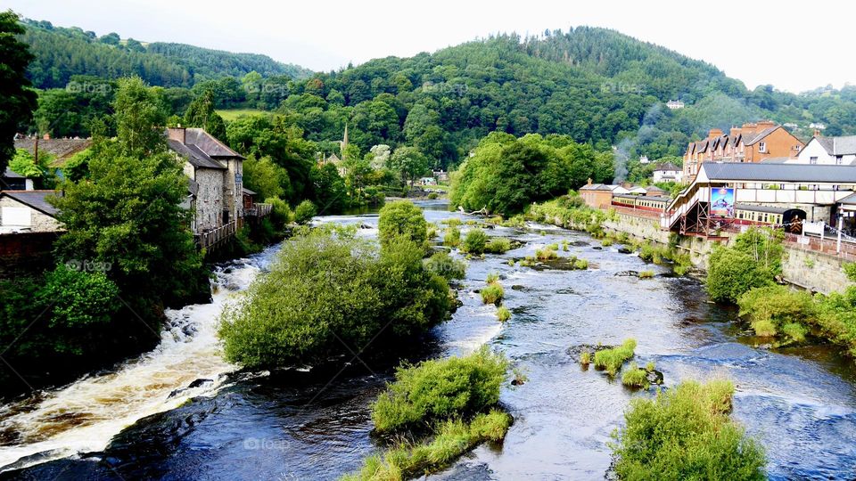 Village with a river crossing in the middle 