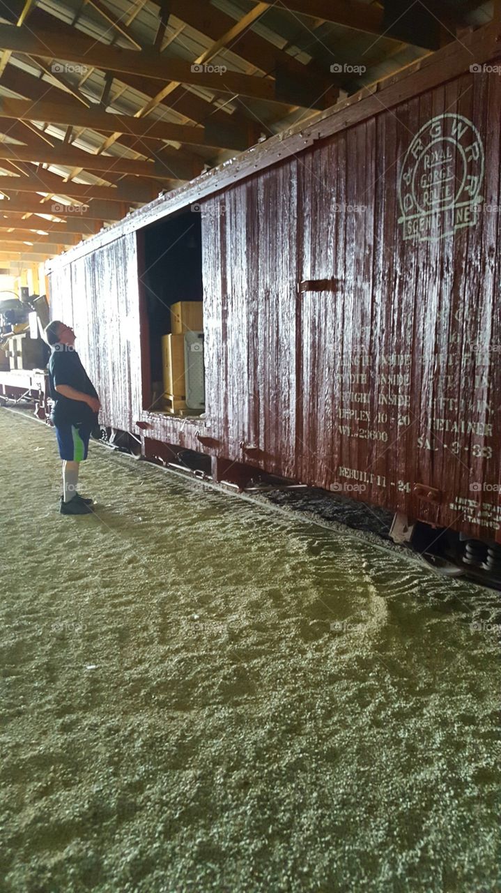 A boarding a train at the station.