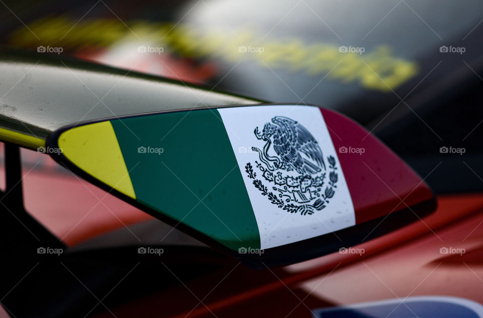 Mexican flag at the back of a race car
