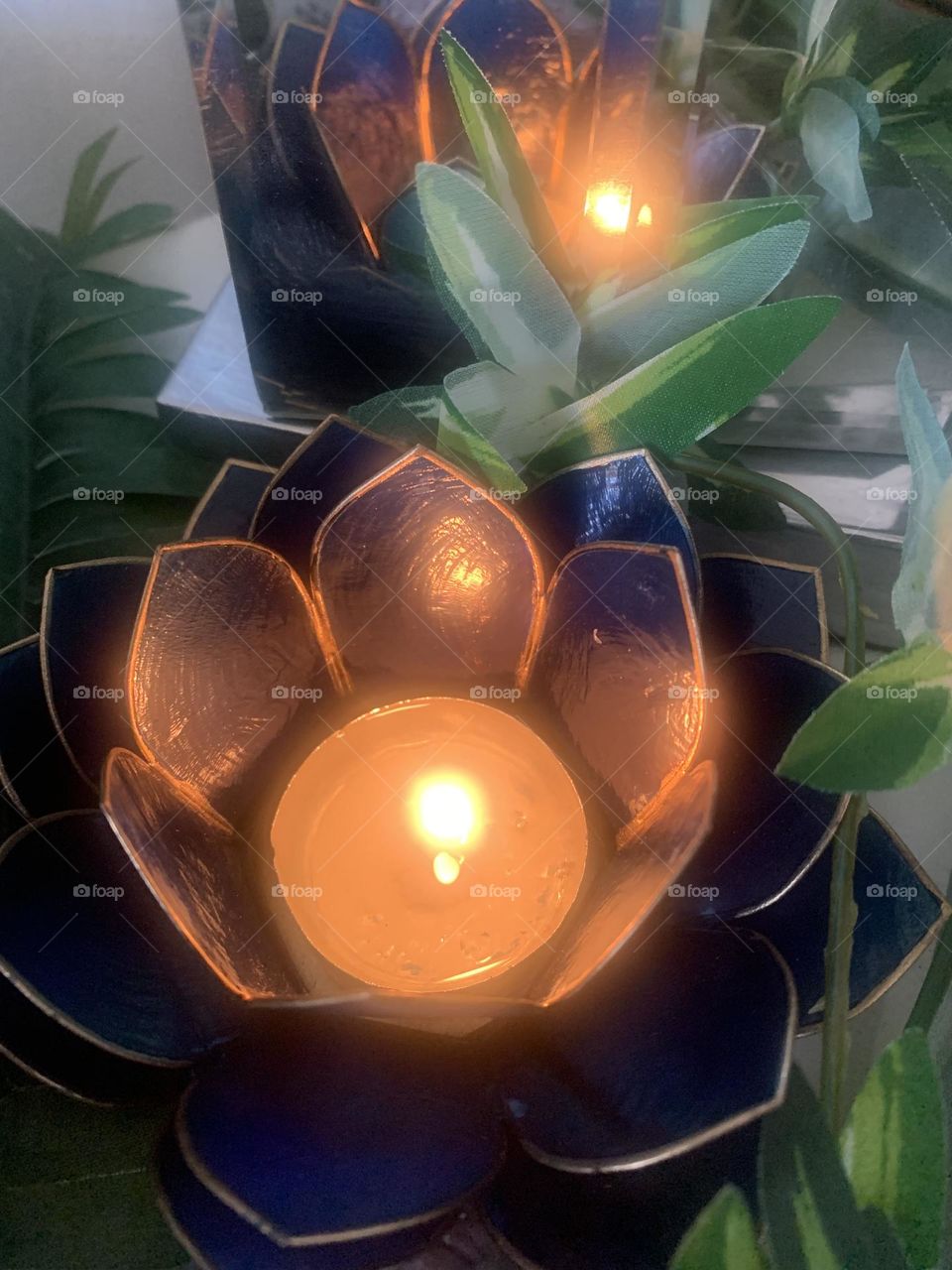 Candle and greenery reflection 