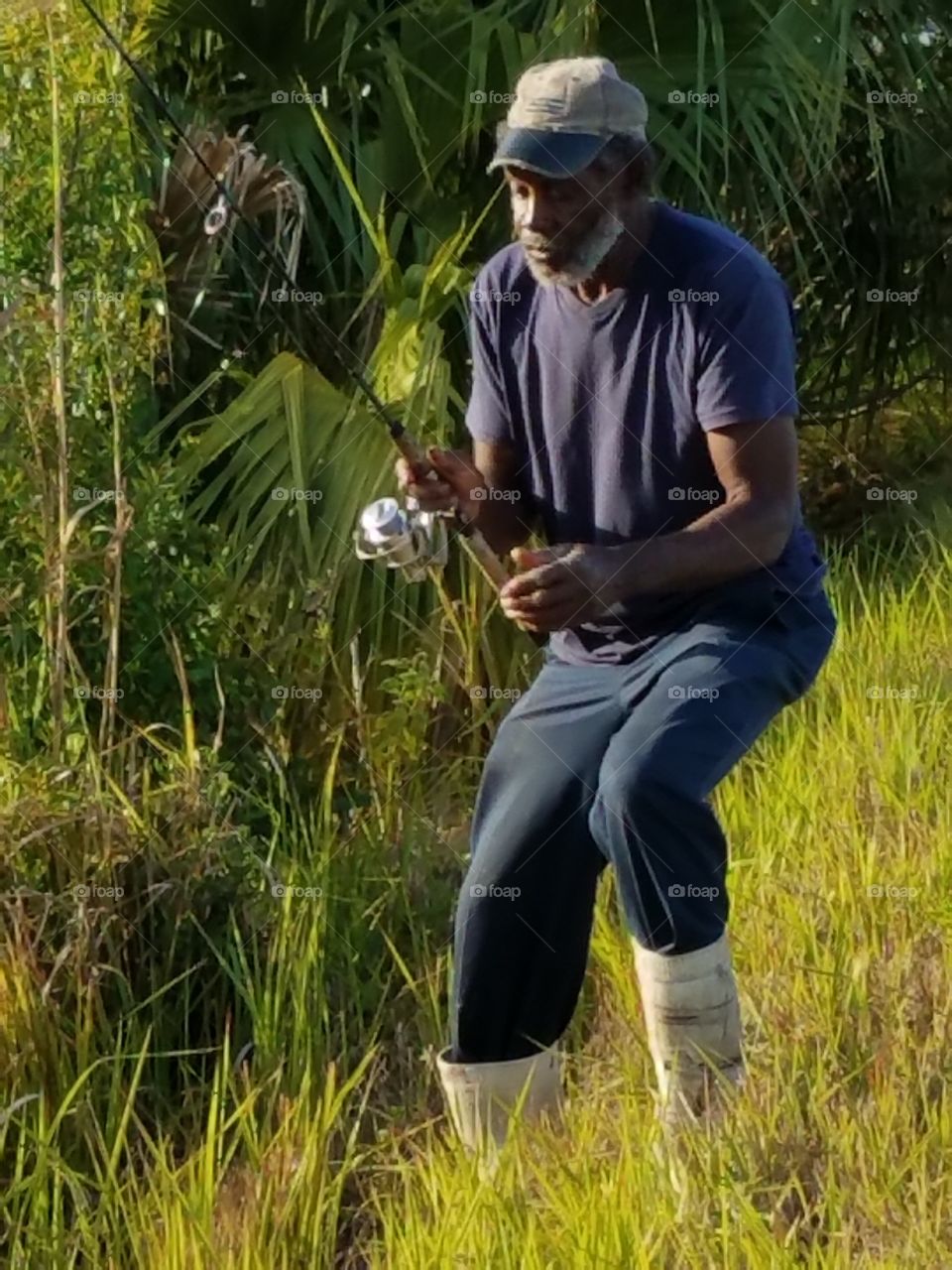 Fisher man holding fishing rod