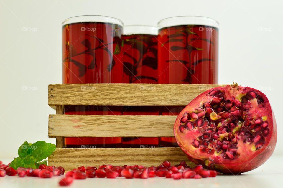 three glasses of pomegranate exstract