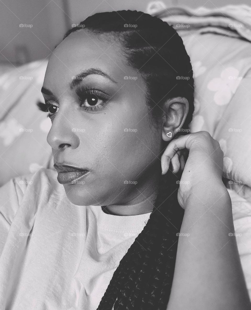 African American woman with makeup on. A moody picture.