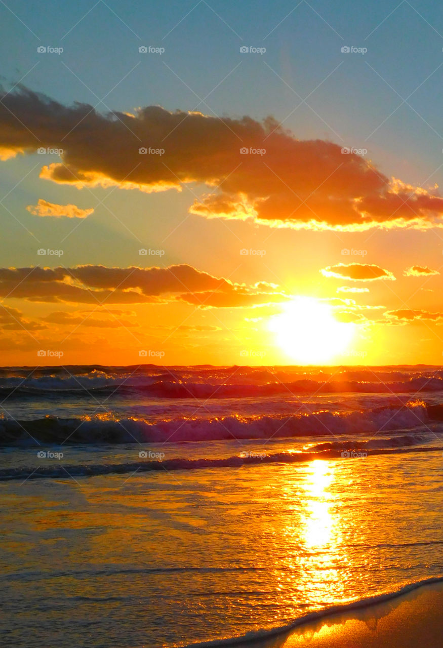 Descending Delight!
The sunset over the Choctahatchee Bay as it descends below the horizon and casts a reflection across the water!