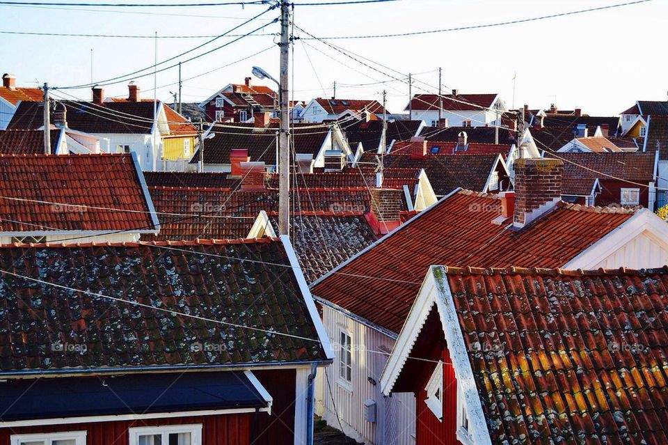 island houses telephone pole red rooftops by anetteaventyr