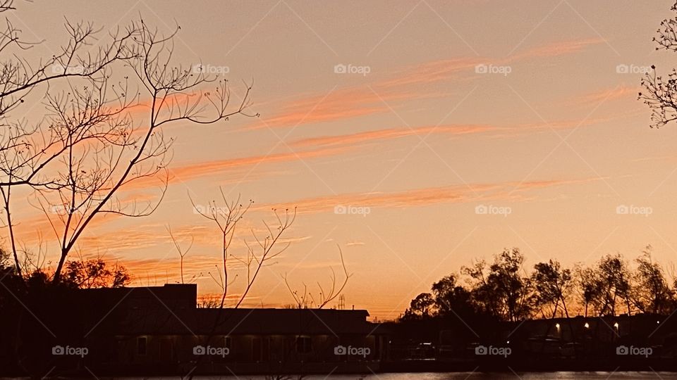 The Pastel colors of the High clouds begin to brighten and become more visible with the faint background. 