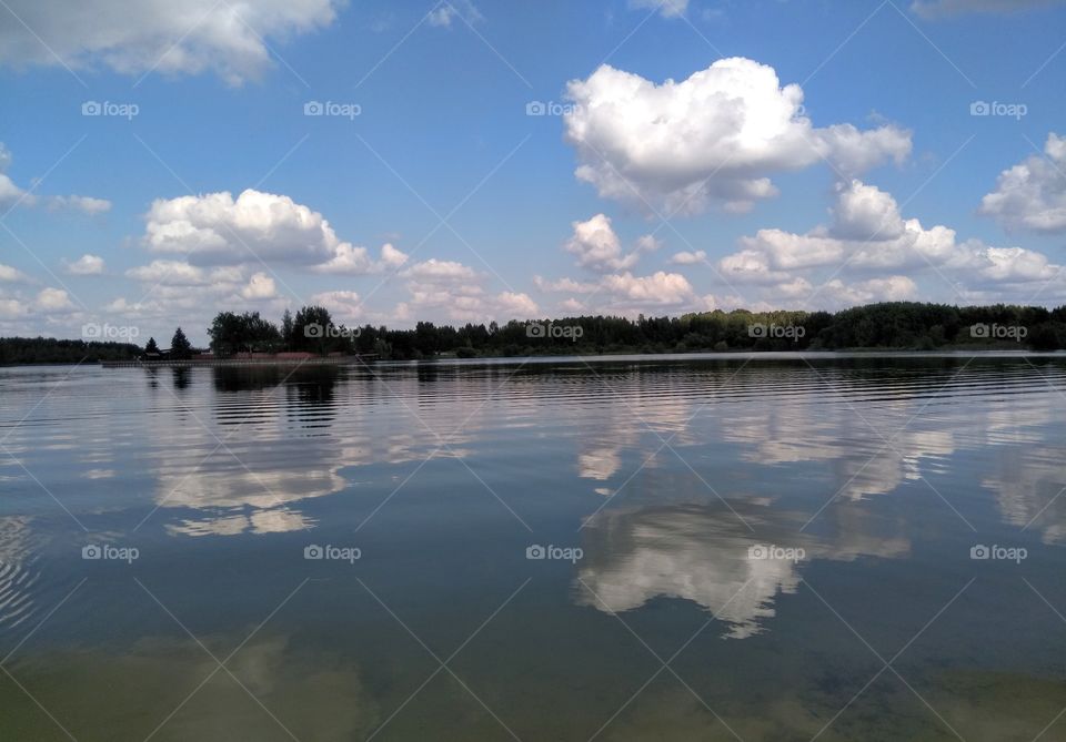 lake summer landscape and sky clouds reflection