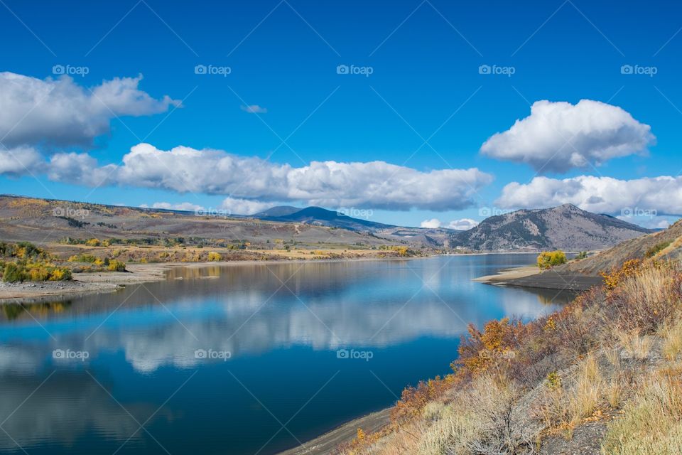 Clouds reflecting on river