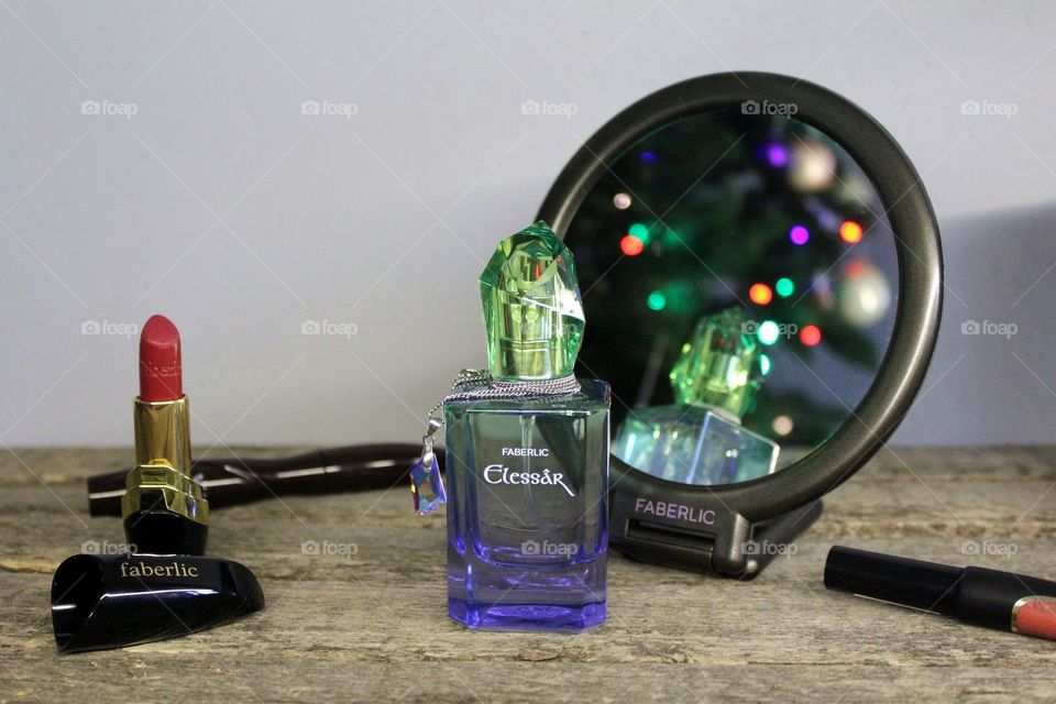 Perfume Elessâr, mirror, lipstick, lipgloss and mascara from Faberlic.