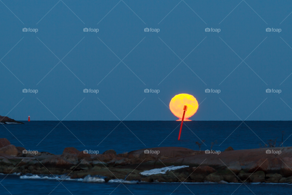rocks dusk baltic sea full moon by cls