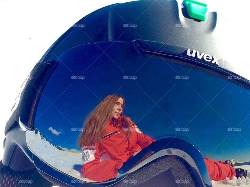 Reflection of woman in the ski glasses