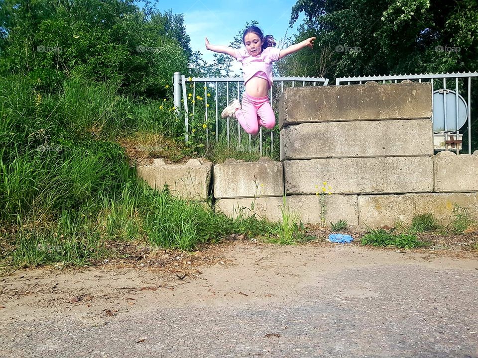 girl jumps in the air