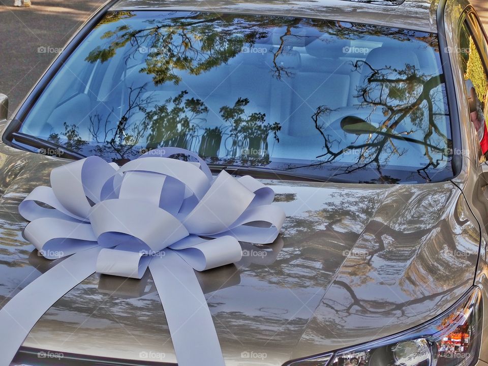 Brand New Car. New Car Wrapped With A Large Bow And Ribbon
