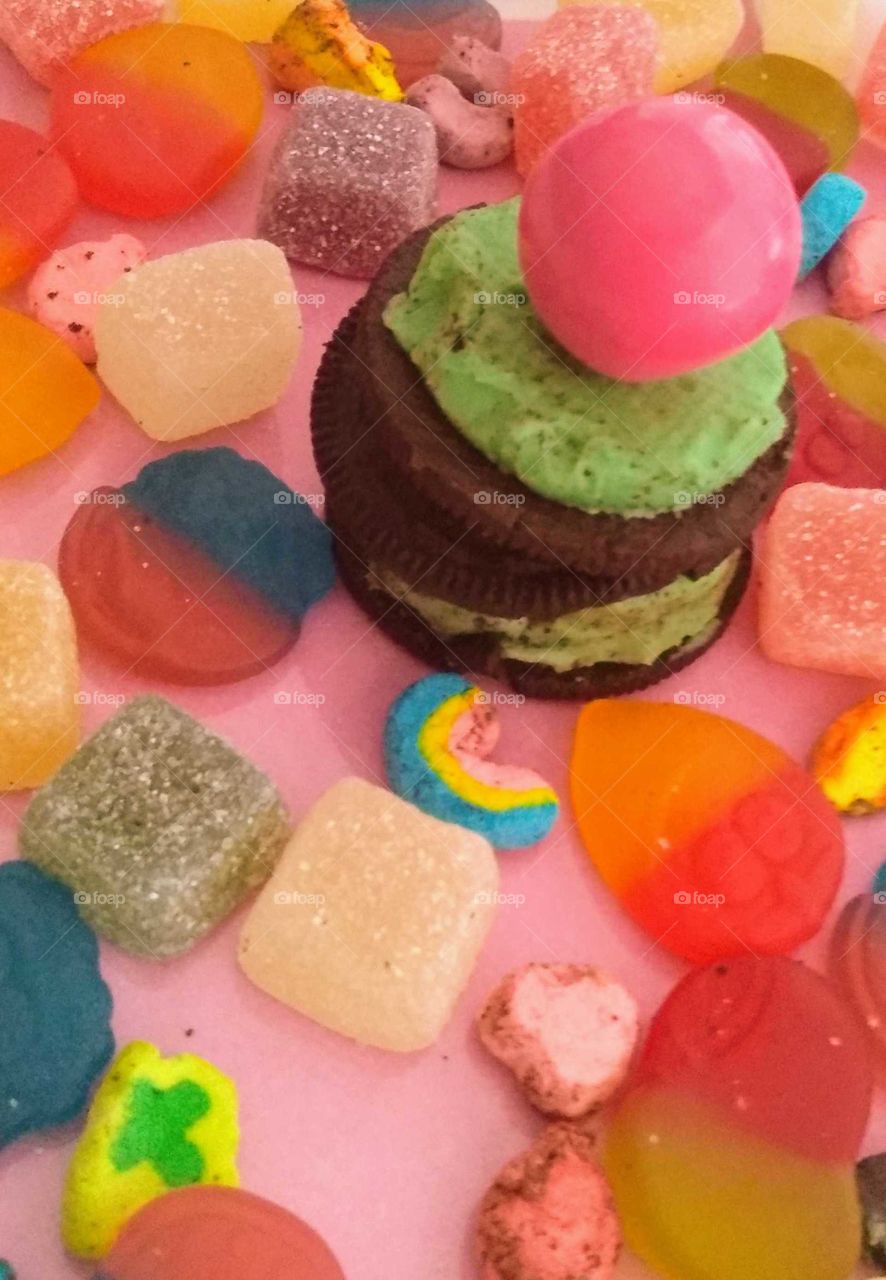 assorted candy, Oreo mint, a pink gumball on top