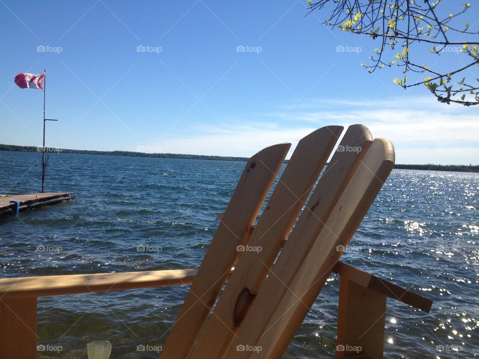 Green buds on the trees, water goes on for miles. I could stay here forever in this chair. 