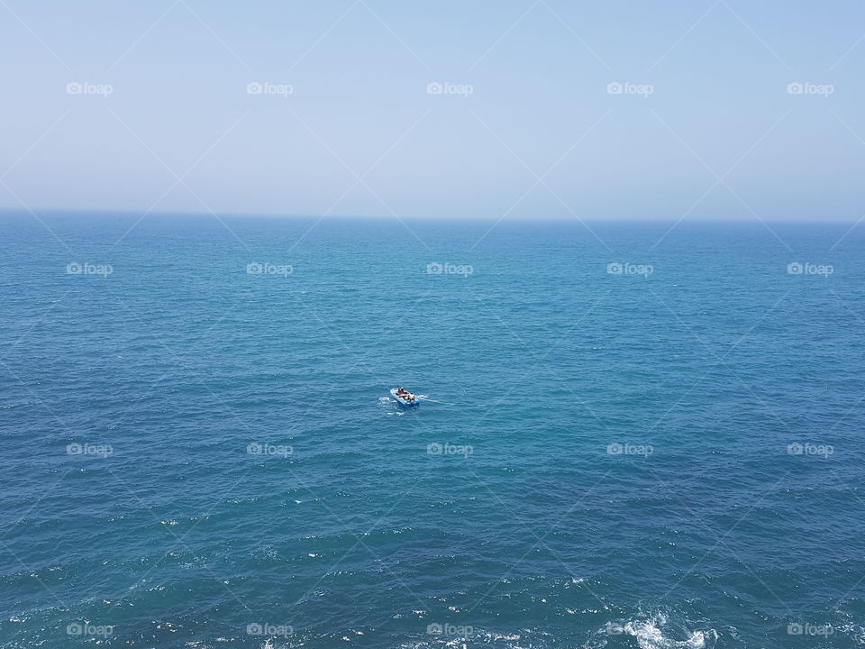 beach boat alone in water