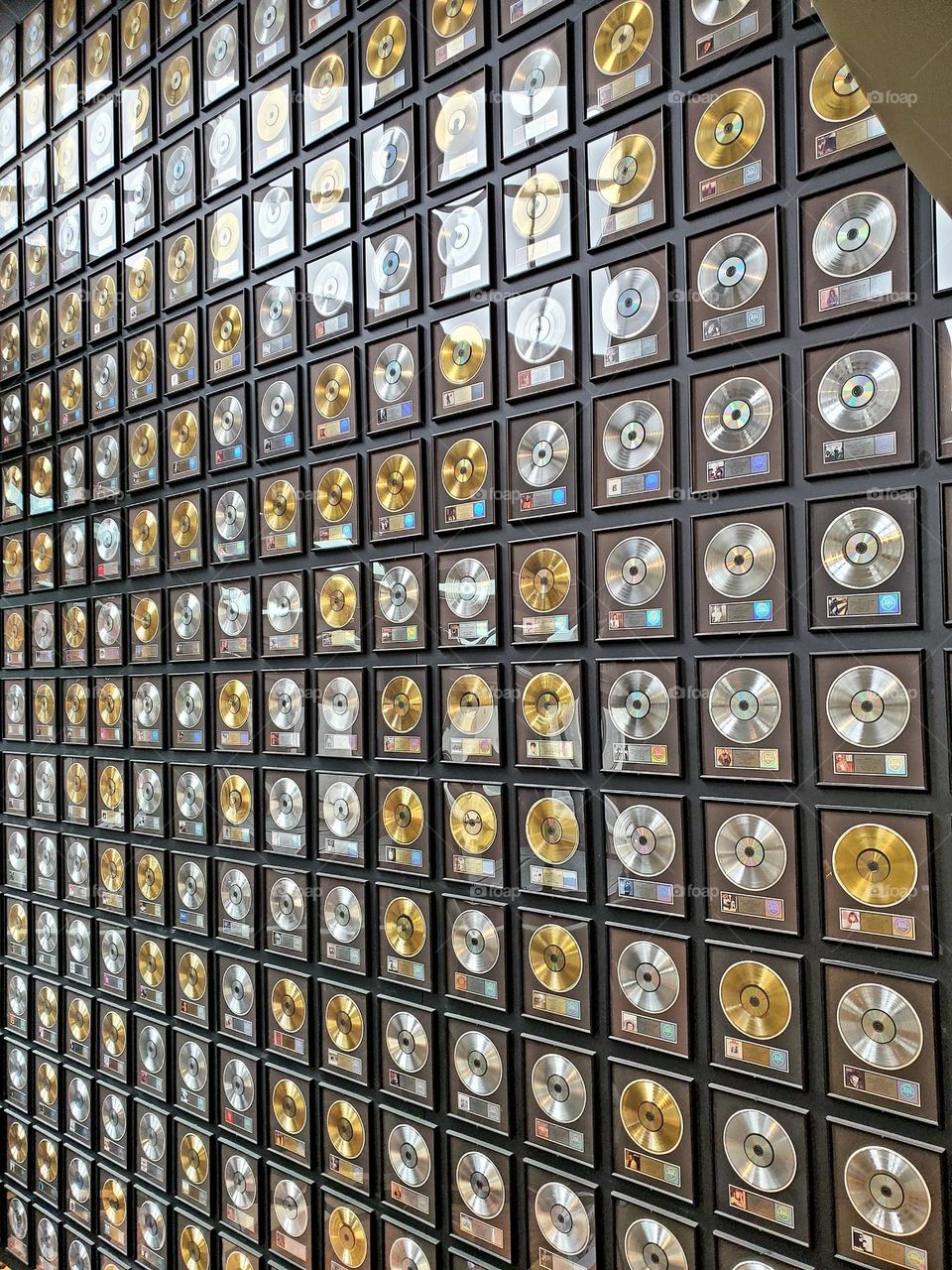 A wall of gold and platinum records adorns the Country Music Hall of Fame in Nashville