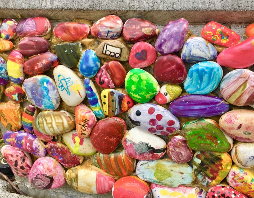 Multicolor painted stones created by elementary school students