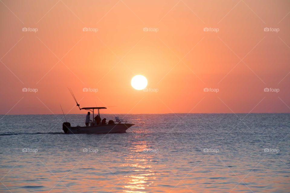 Silhouette boat on a sunrise 