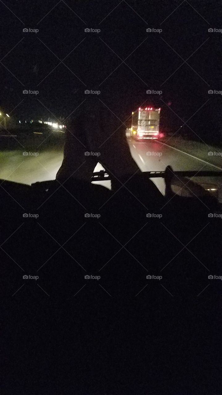 got my feet up on the dash of the truck. They look like mountains! I've got BIG feet.