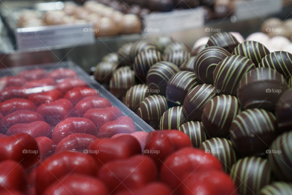 Swiss chocolate hearts. Swiss chocolates in the shape of hearts laid out in a shop