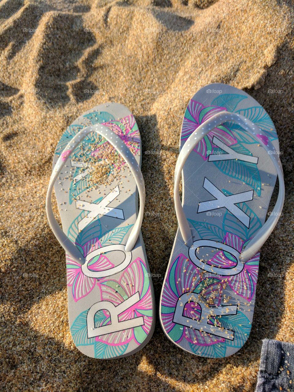 slippers on the beach