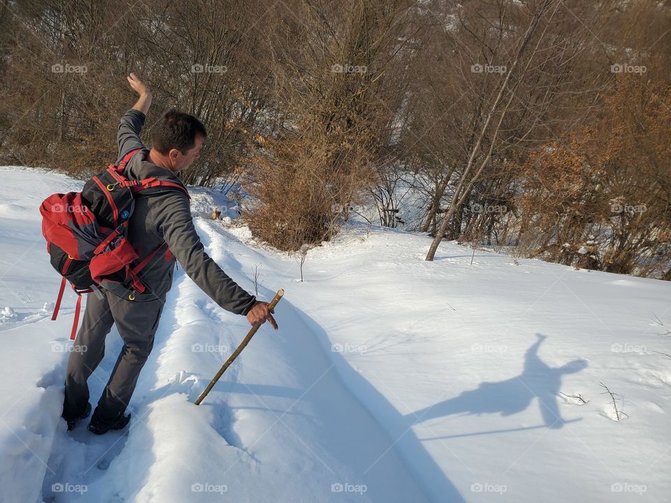 The man controls his shadow