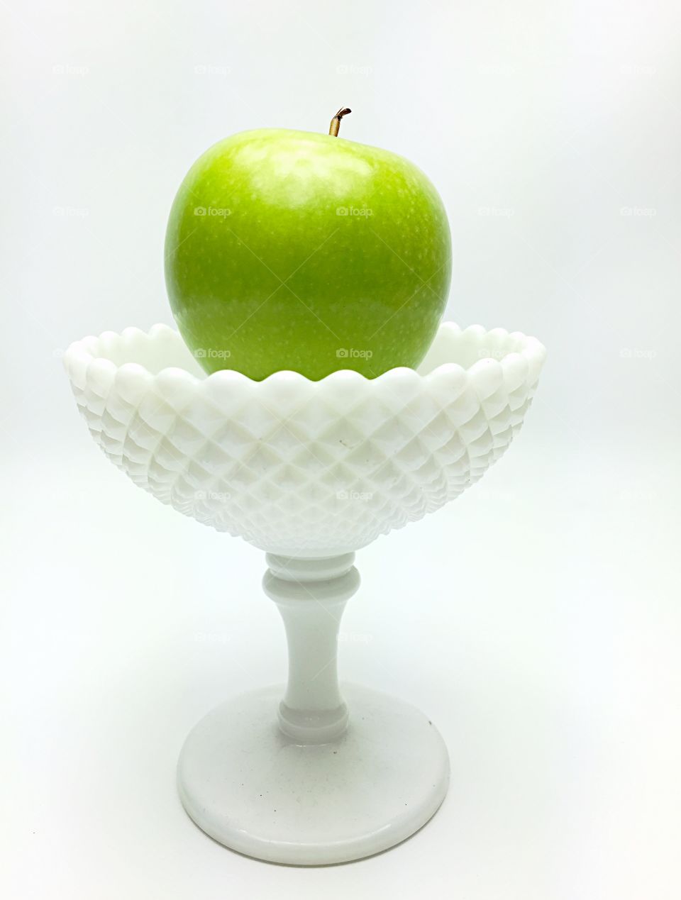Green apple . Green apple in glass cup 