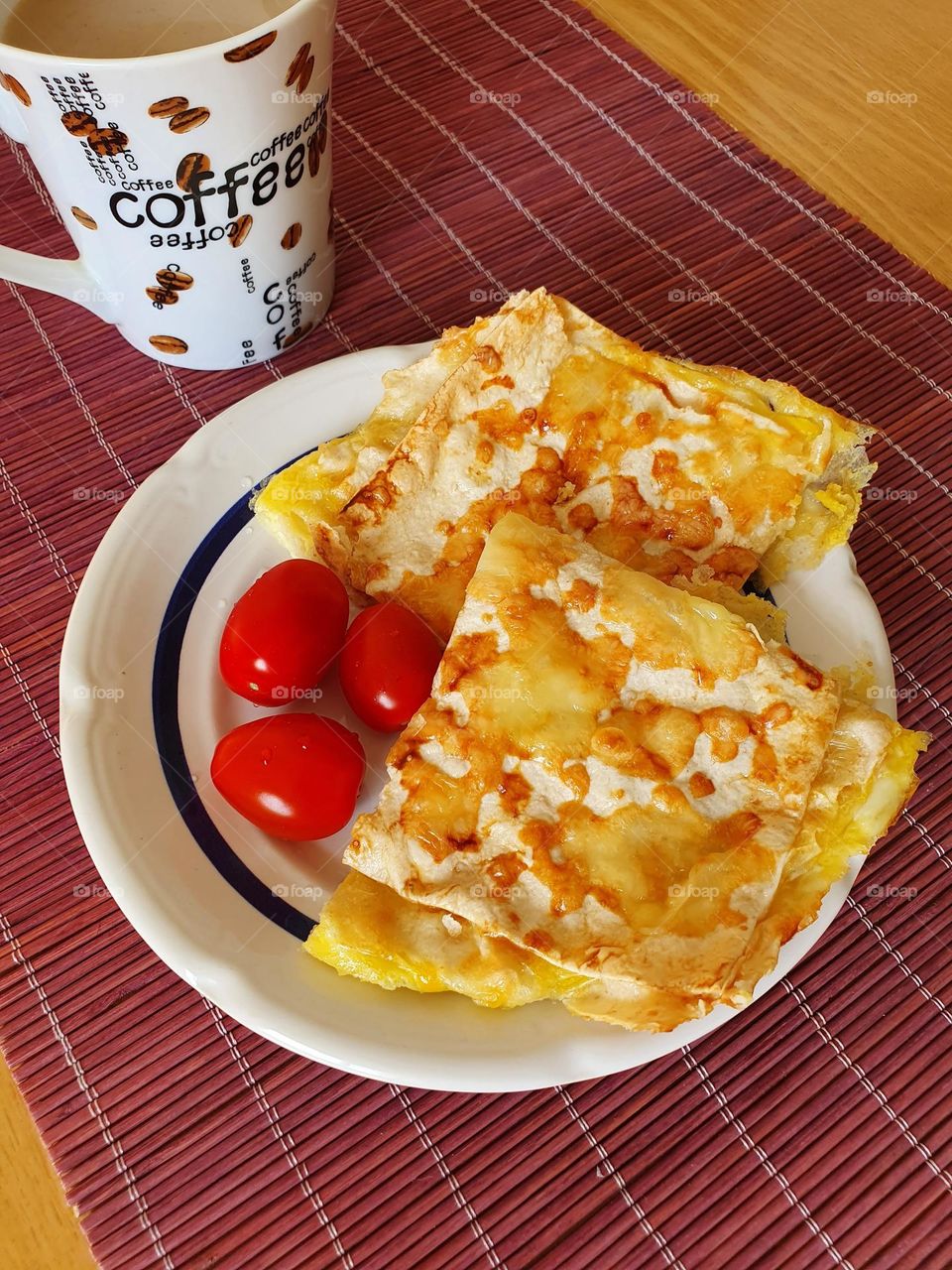 Colorful breakfast with cherry tomato and coffee.