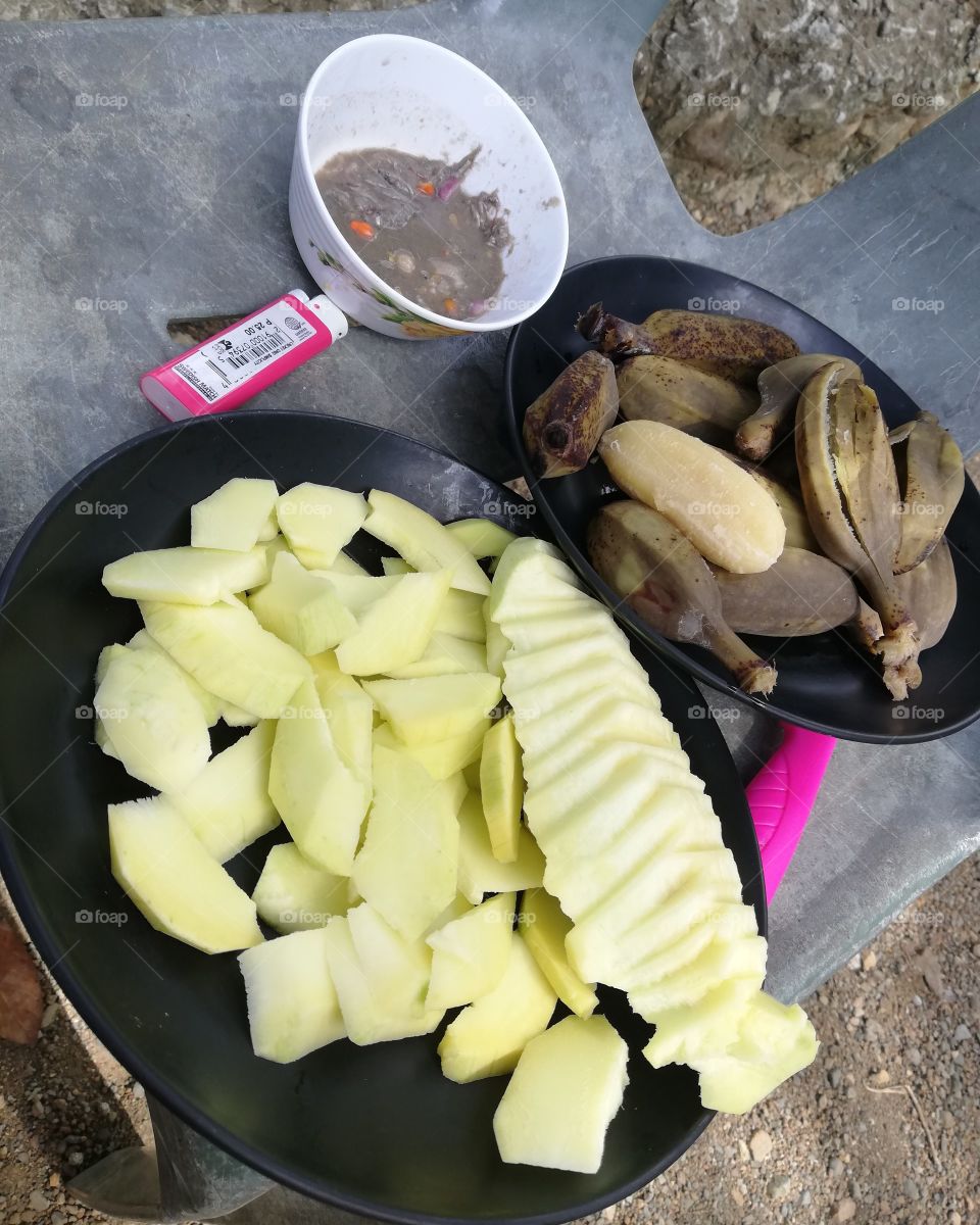 unripe Mango with unripe banana and anchovies