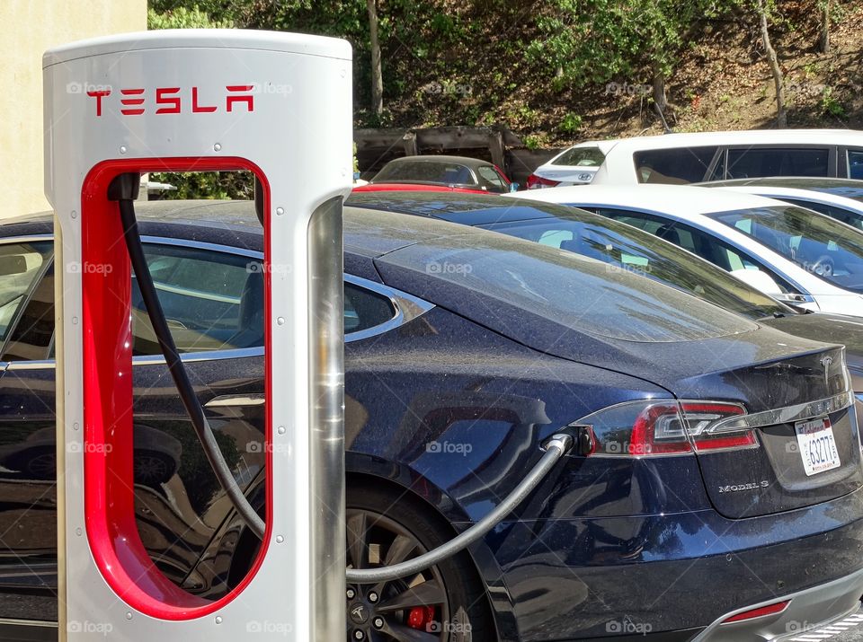 Tesla Car. Tesla Model S  At A Charging Station
