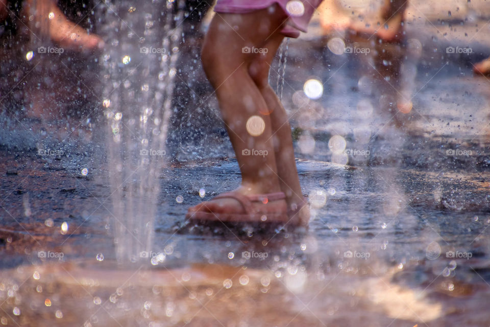 Having fun at a splash pad