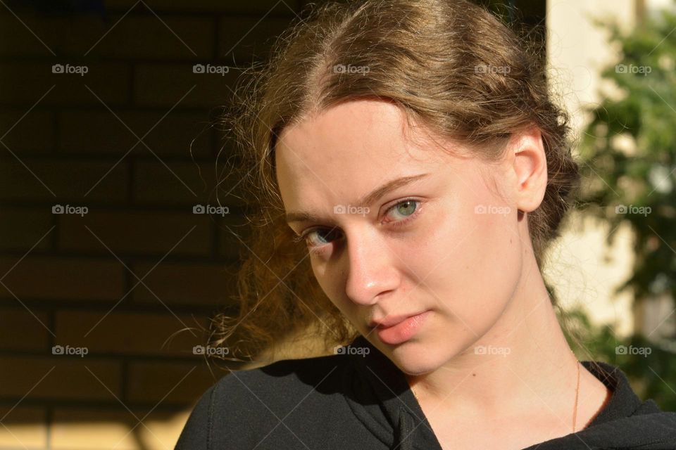 girl beautiful portrait close up on a wall background, natural beauty woman