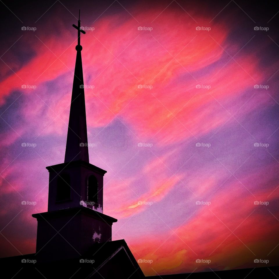 Holiness church spire against the December evening sky