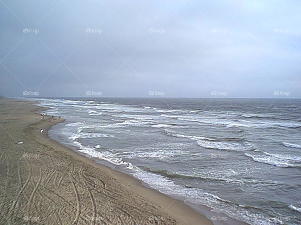Beach shallow waves coming in