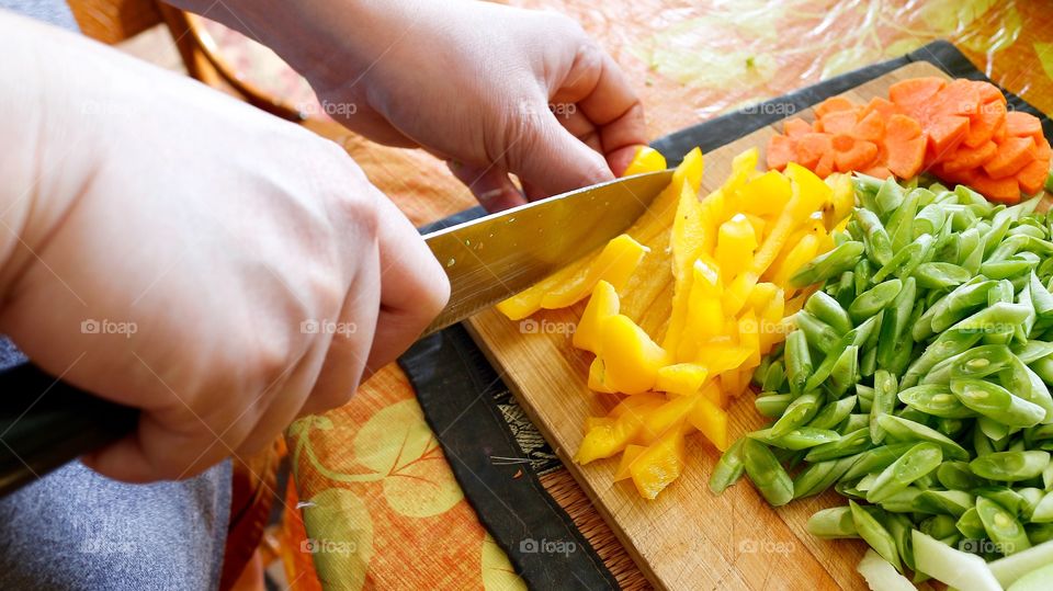 Close-up of a person cutting vegetables