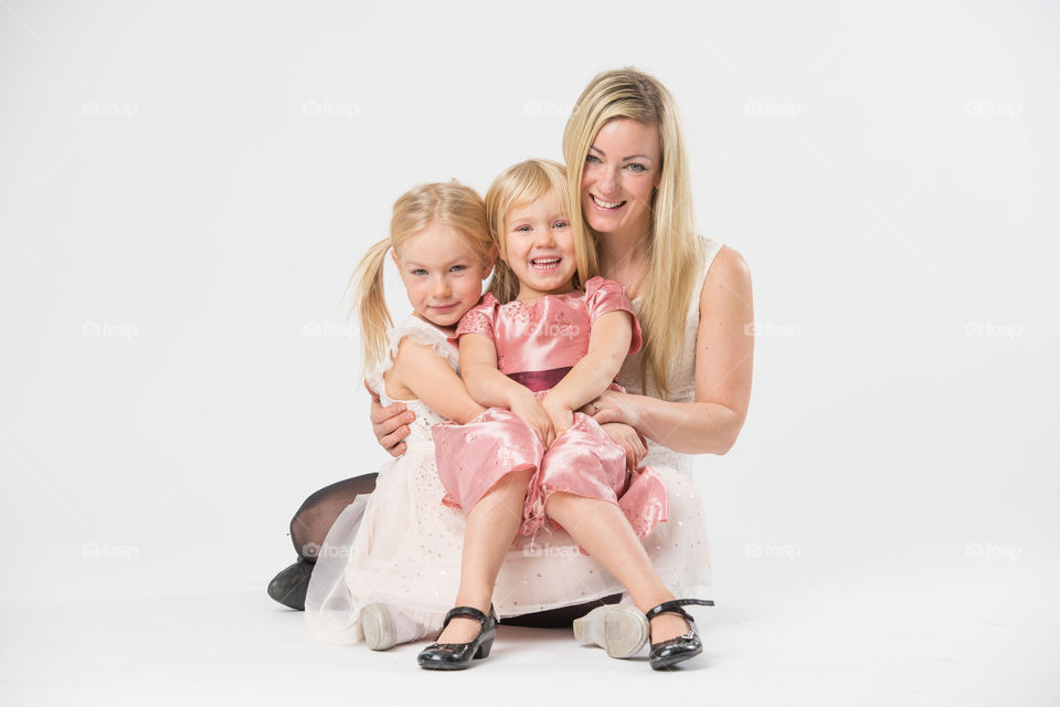 Happy family, mother with her two daughters of 6 and four years old.